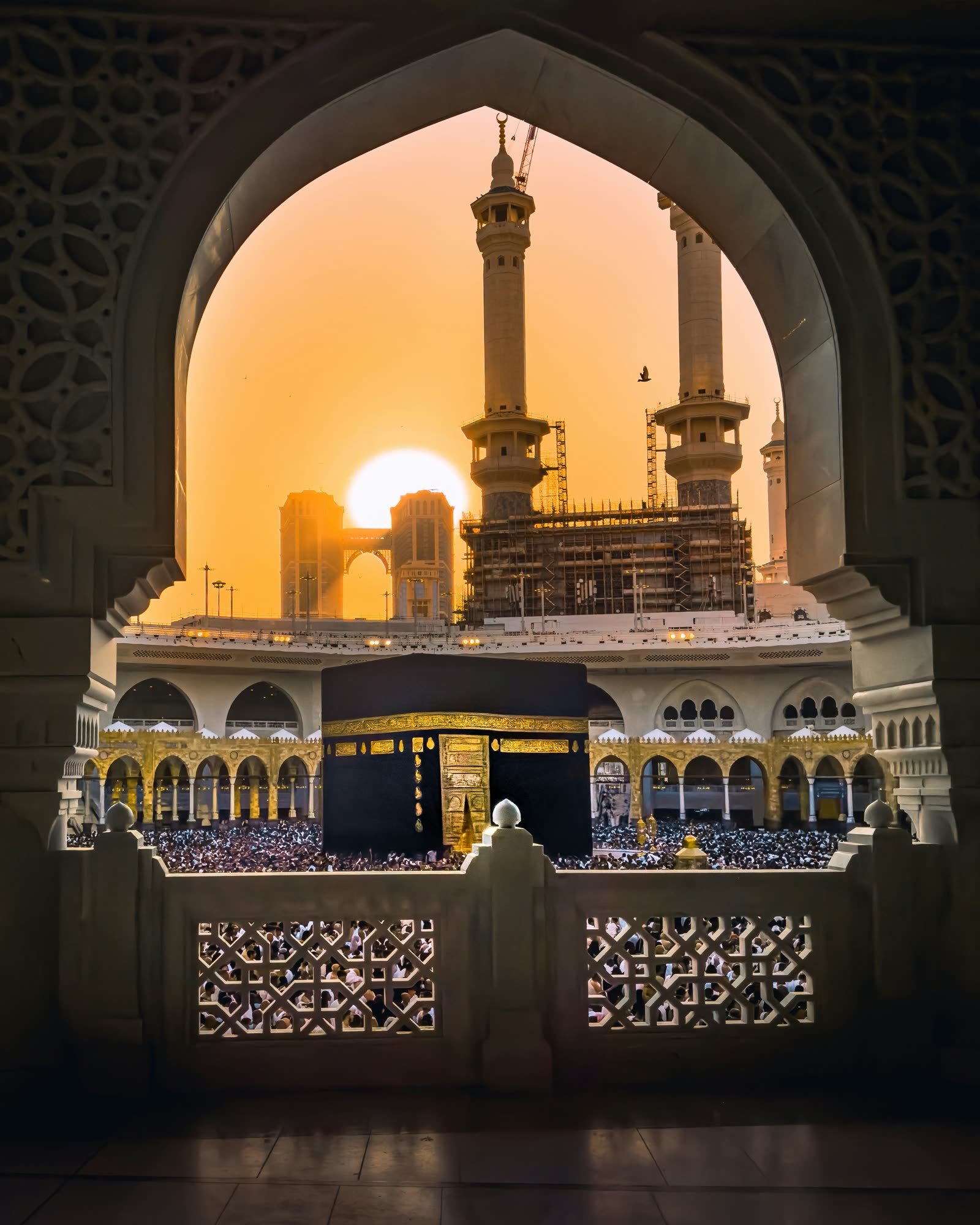 The Kaaba seen through an arch at sunset